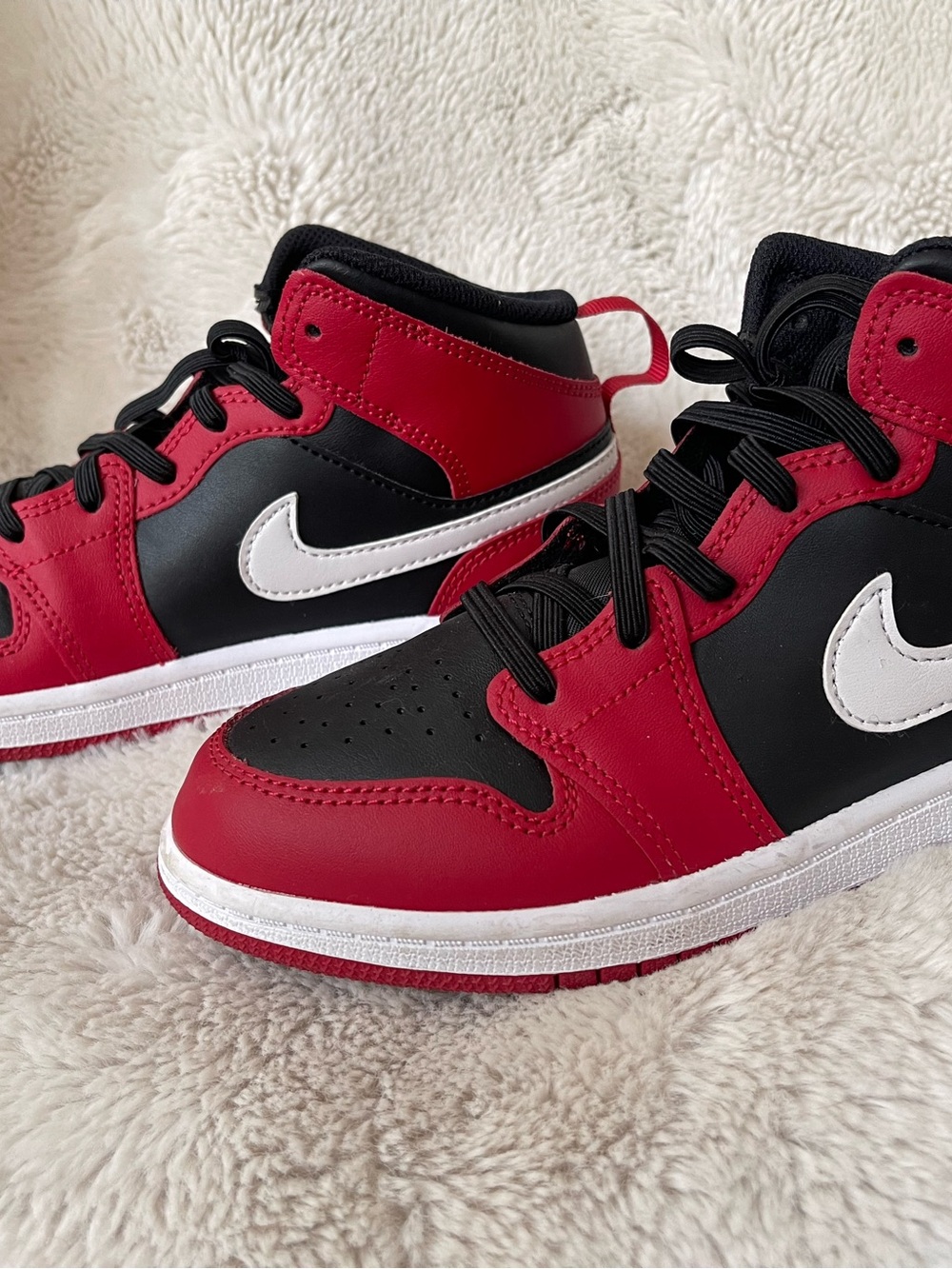 Nike/Jordan Kids Red and Black Mid-Top Sneakers with White Swoosh